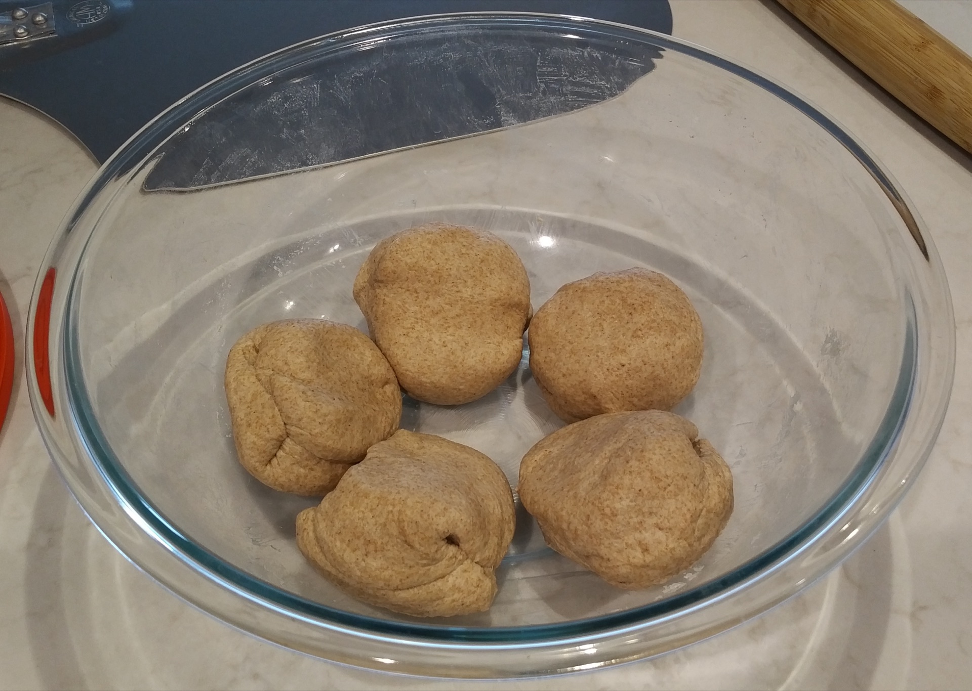 Five dough pieces in a container
